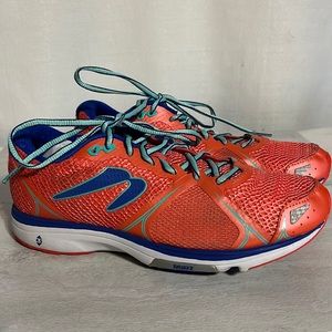 Bright orange Newton running shoes